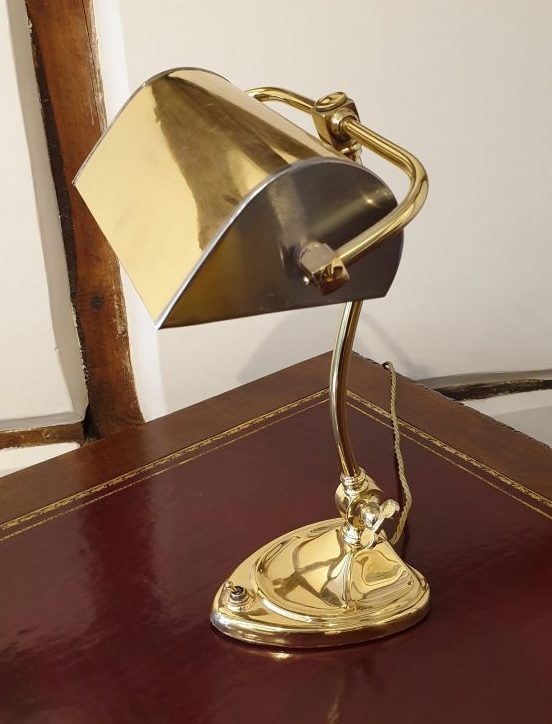This attractive Early 20th Century antique brass and steel desk lamp has been repaired, refinished re-wired and of course tested. 