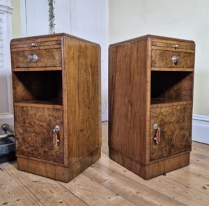 Pair of original Art Deco burr walnut bedside cabinets with Bakelite and chrome handles.