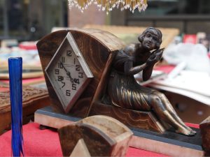 A typical French Art Deco period marble and spelter figural clock