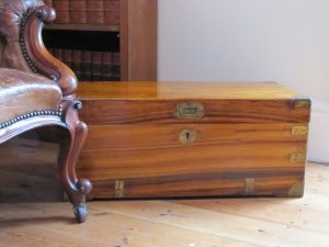 An antique 19th Century brass bound camphor travelling trunk - current valuations for such pieces of furniture reflect their popularity.