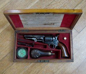 Colt is a desirable name amongst collectors of antique arms.The chamber of this cased Colt 5-shot percussion cap revolver is engraved with images of carriages, horses, and men.