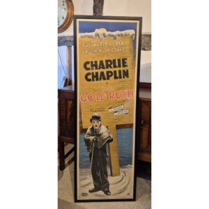 An original film poster adverting the release of United Artists talking version of the 'Gold Rush' starring Charlie Chaplin in 1942