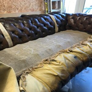 The newly sprung seat of the old Chesterfield with an additional layer of hessian.