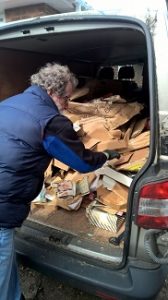 Separating cardboard for recycling whilst clearing a bungalow in West Sussex 