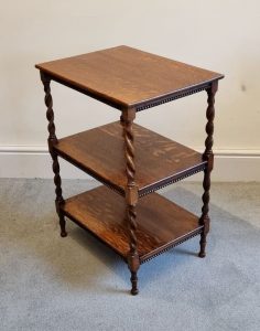 A 3 tier table which has barley-twist supports and is made from oak, which has attractive figuring created by the timber's Medullary Rays. It would sit comfortably beside a sofa.