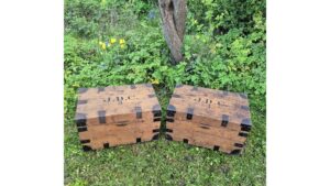 A pair of antique iron bound pine travelling trunks that belonged to Jessie Degan Cole of Dawn House in Winchester.