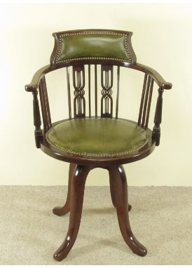 An Edwardian mahogany revolving desk chair after our furniture restoration team and upholsters have worked their magic