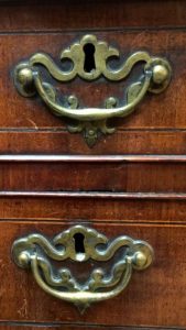 Our valuations show, antique furniture that retain a high degree of originality will generally out perform other examples: a close up of two original handles fitted to a good English walnut chest of drawers (Circa 1740). 